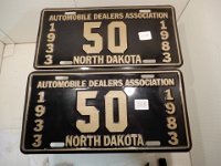 258 - MATCHED PAIR OF NORTH DAKOTA AUTOMOBILE DEALERS 50TH ANNIVERSARY LICENSE PLATES, 1933 - 1983