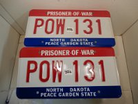 356 - MATCHED SET OF ND POW LICENSE PLATES