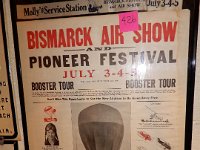 426 - BISMARCK AIR SHOW POSTER WITH MOLLY'S GAS STATION RIBBON, POSTER 19" X 24"