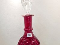 107 - RUBY GLASS DECANTER WITH CLEAR STOPPPER