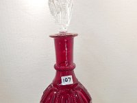 107 - RUBY GLASS DECANTER WITH CLEAR STOPPPER